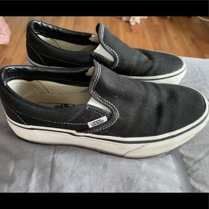 Black and white high top vans